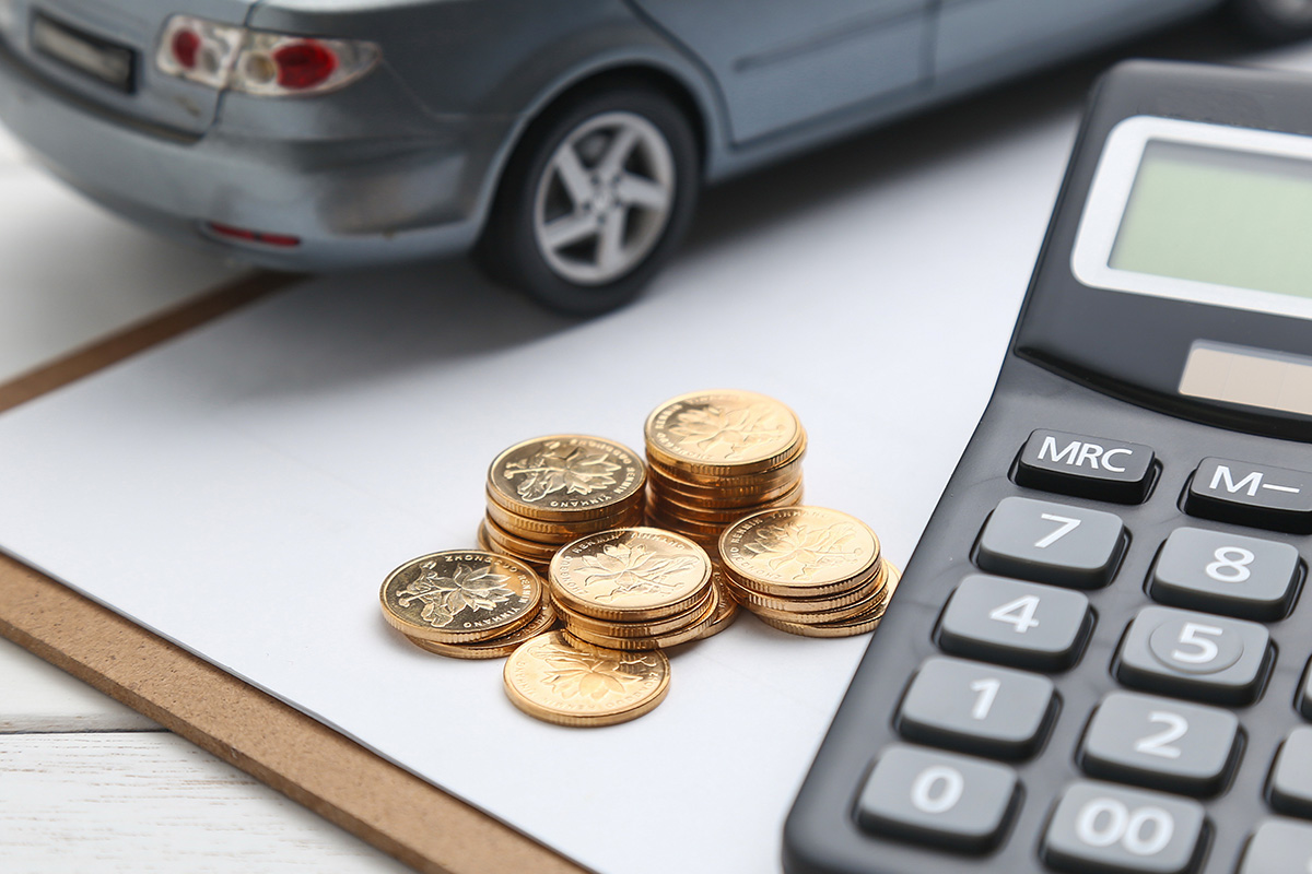 coins, calculator and toy car