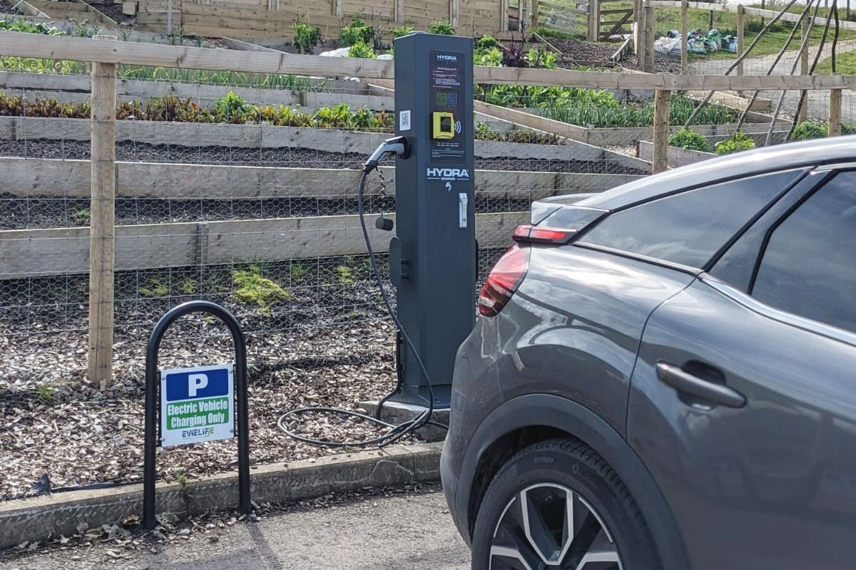 Hydra Genesis 22kW installed in car park charging a car with contactless payment